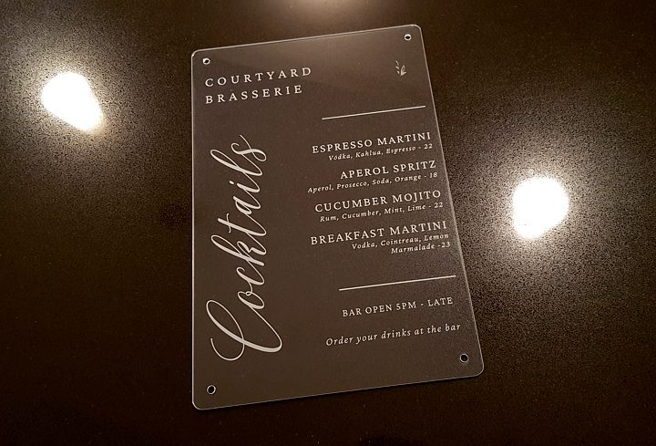 Menu card displayed on a table with Good Brand Visibility